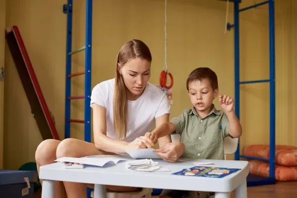 mother-and-son-draw-at-a-table-inside-the-room-2026-01-11-08-52-24-utc-69b7e5669df39